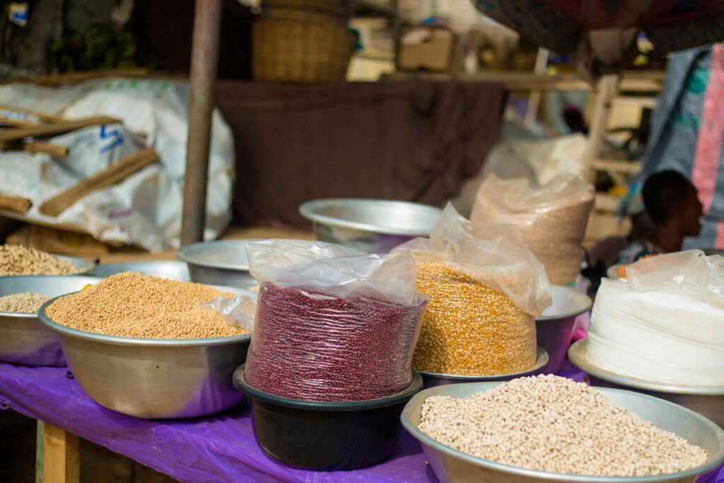 Colorful display of different grains in a market in Accra, Ghana, showcasing local food diversity.